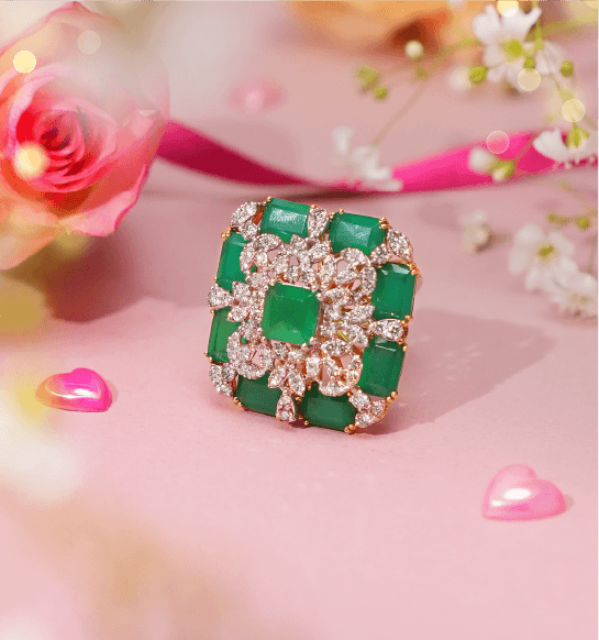 Luxury emerald diamond ring in gold with square green gemstone and sparkling diamonds